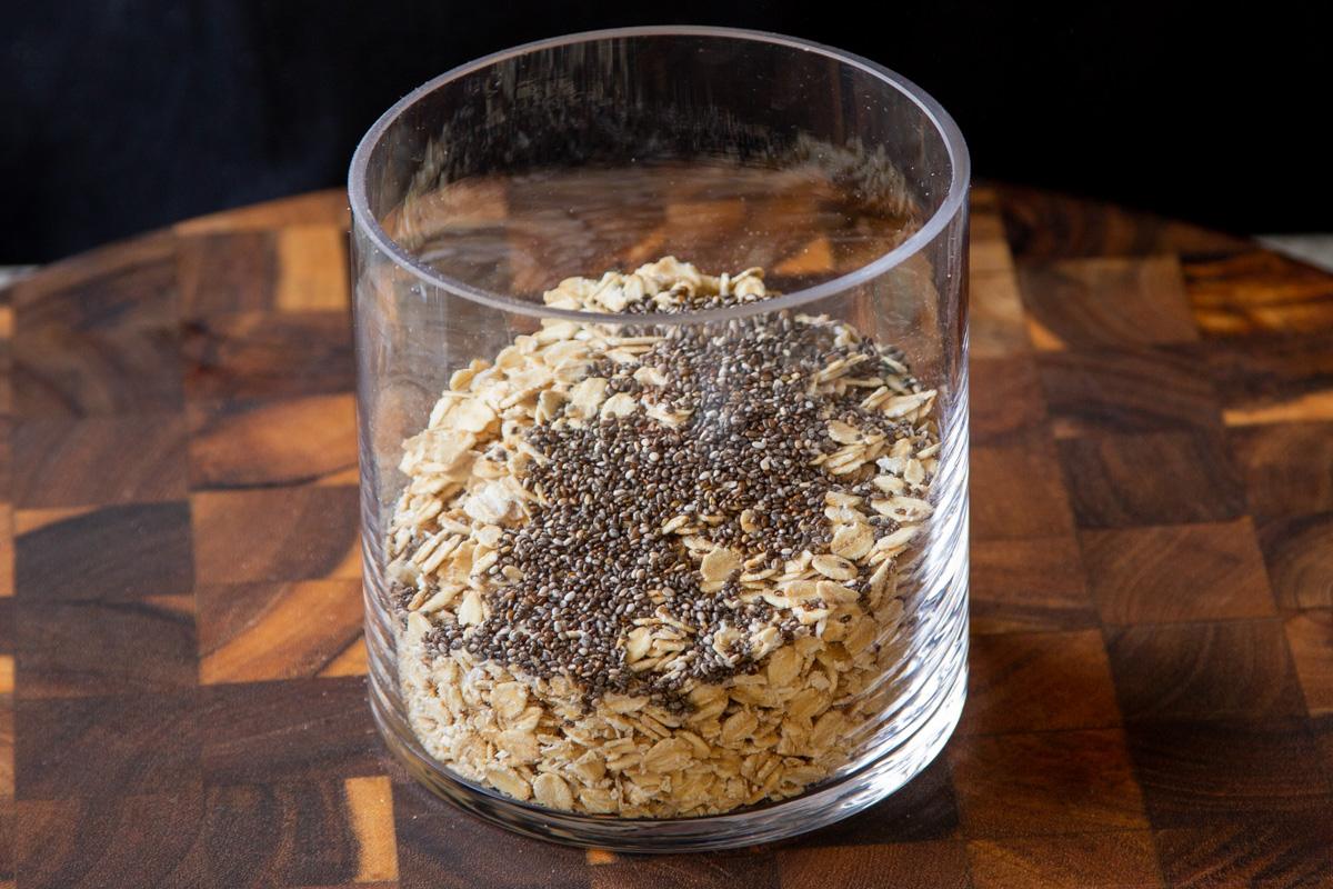 chia seeds and rolled oats in a glass bowl