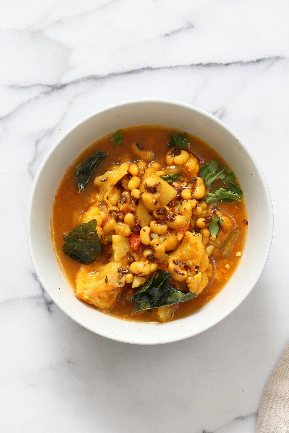 This coconutty Black Eyed Pea stew with Cauliflower and Potatoes is hearty and delicious. Instant Pot Black Eyed Pea Curry with vegetables. Saucepan Option. Vegetarian Black Eyed Peas Recipe | VeganRicha.com