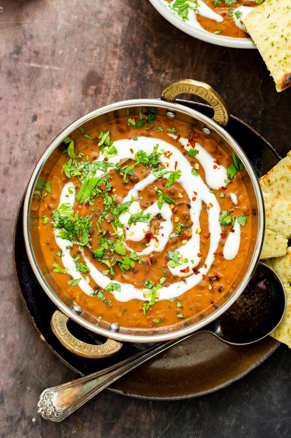 Dal Bukhara served in an Indian dish drizzled with cashew cream