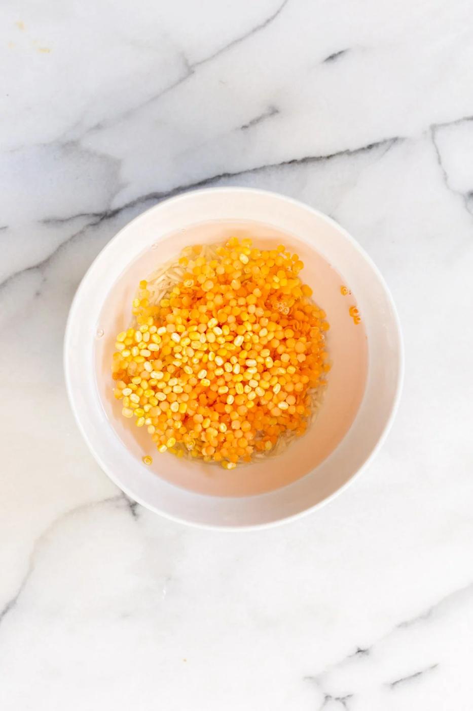 red lentils and rice soaking in water