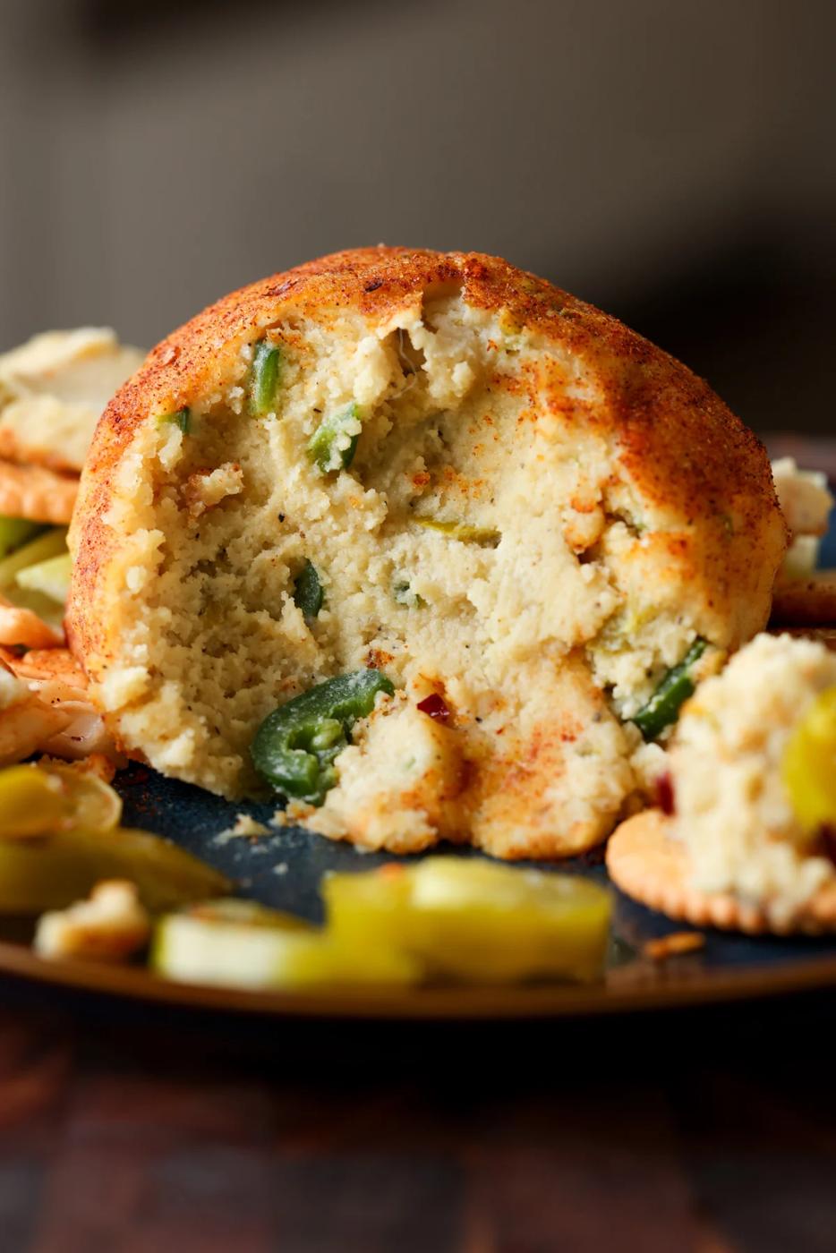 jalapeno popper cheese ball with scoops taken out, so you can see the inside texture
