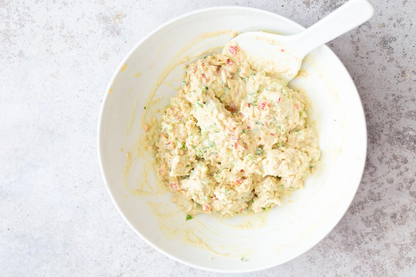 creamy vegan jalapeño chickpea salad in a white bowl