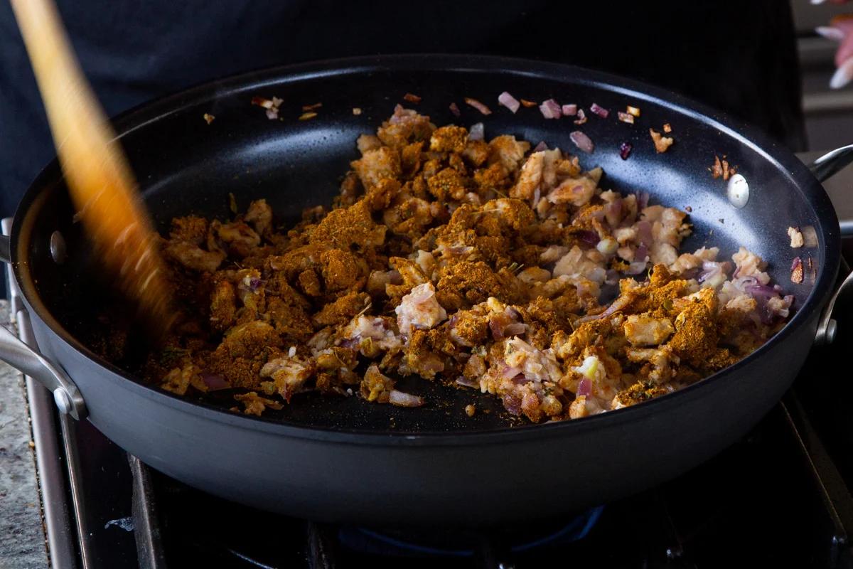 adding Jamaican curry powder and thyme to the soy curls