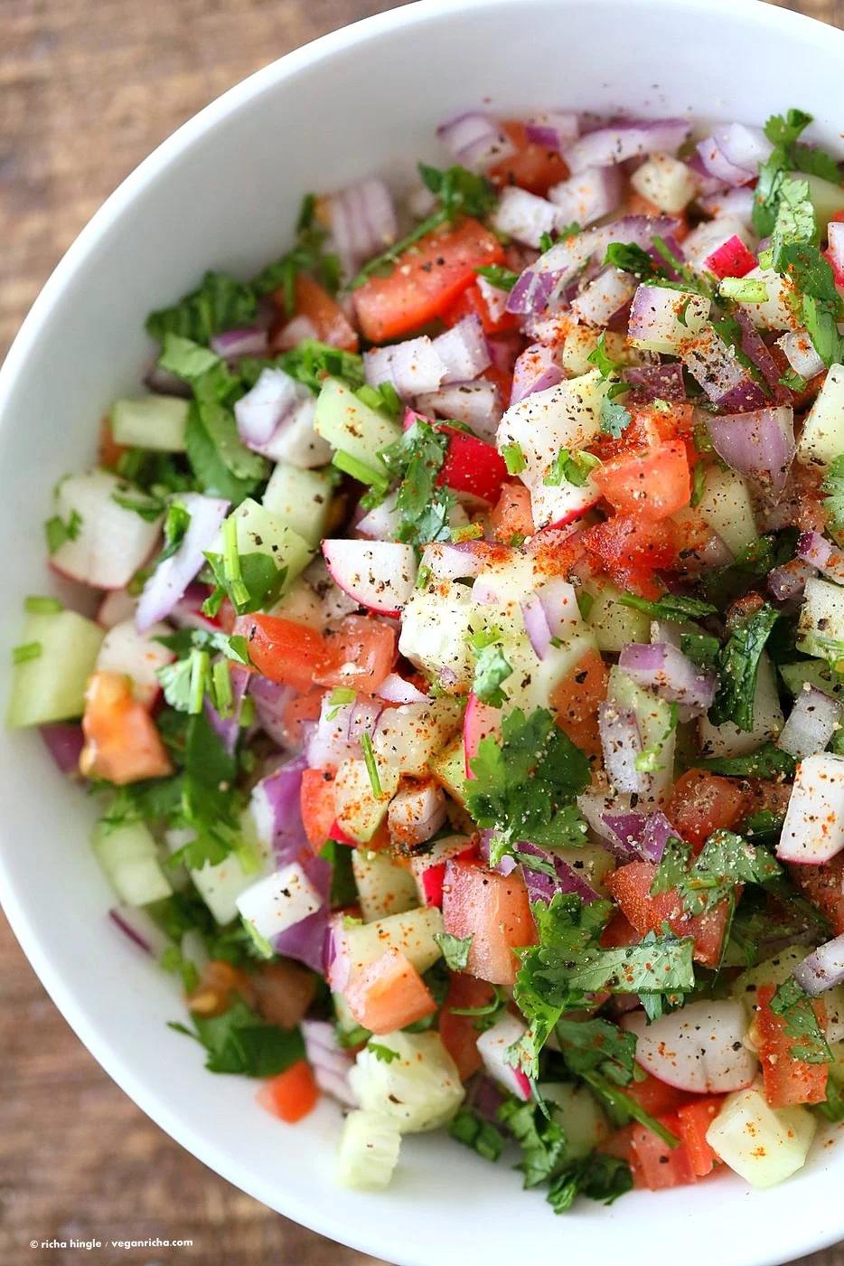 Kachumber Salad - Cucumber Tomato Onion Salad Recipe. Kachumbar is a simple chopped Summer Salad with chopped onions, tomatoes, cucumbers and a salt pepper lemon dressing. Serve as a side with Indian curries, or as a dip with chips, or over burgers. Vegan Gluten-free Soy-free Oil-free Recipe | VeganRicha.com