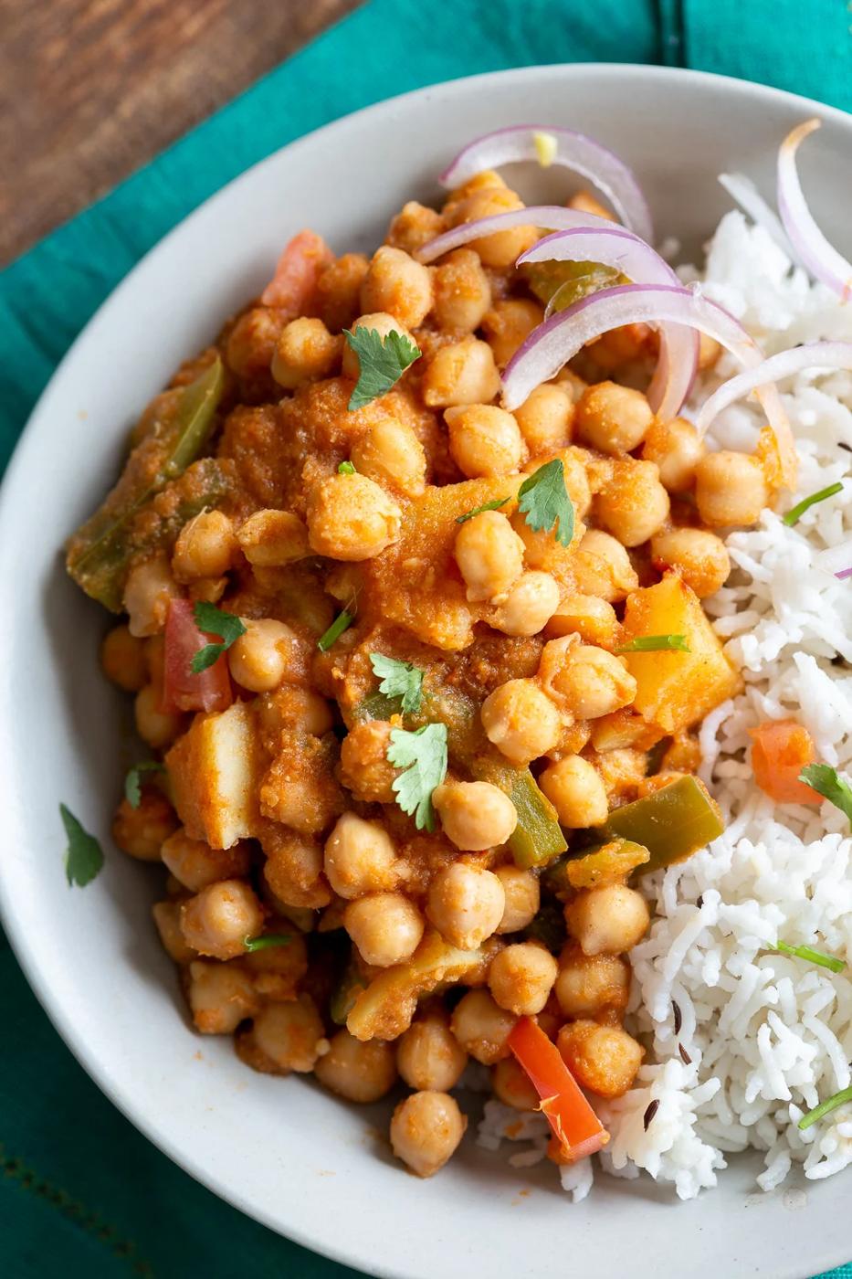 Kadai Chole is a delicious Chickpea curry generally made in wok. 1 Pot 30 min Spiced Chickpeas and Potatoes. Simple Indian sauce paired here with potatoes. #Vegan #Indian #Glutenfree #Soyfree #Nutfree #Recipe #indianvegan #VeganRicha
