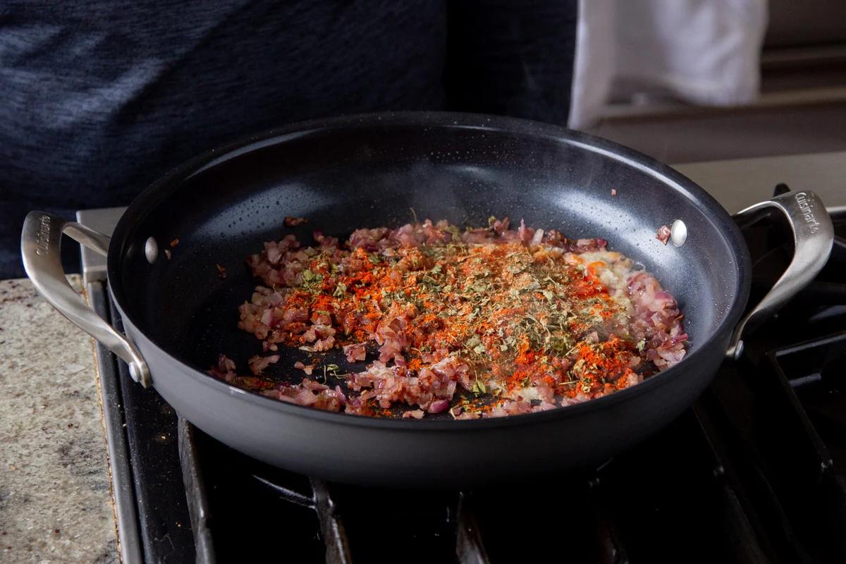 cooked onions in the pan with spices