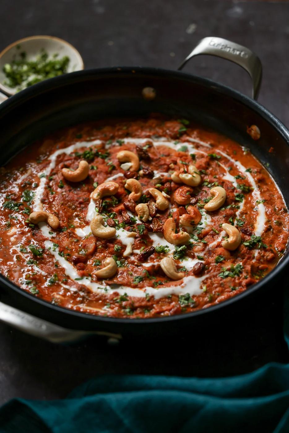 beans korma in the pan topped with cashews