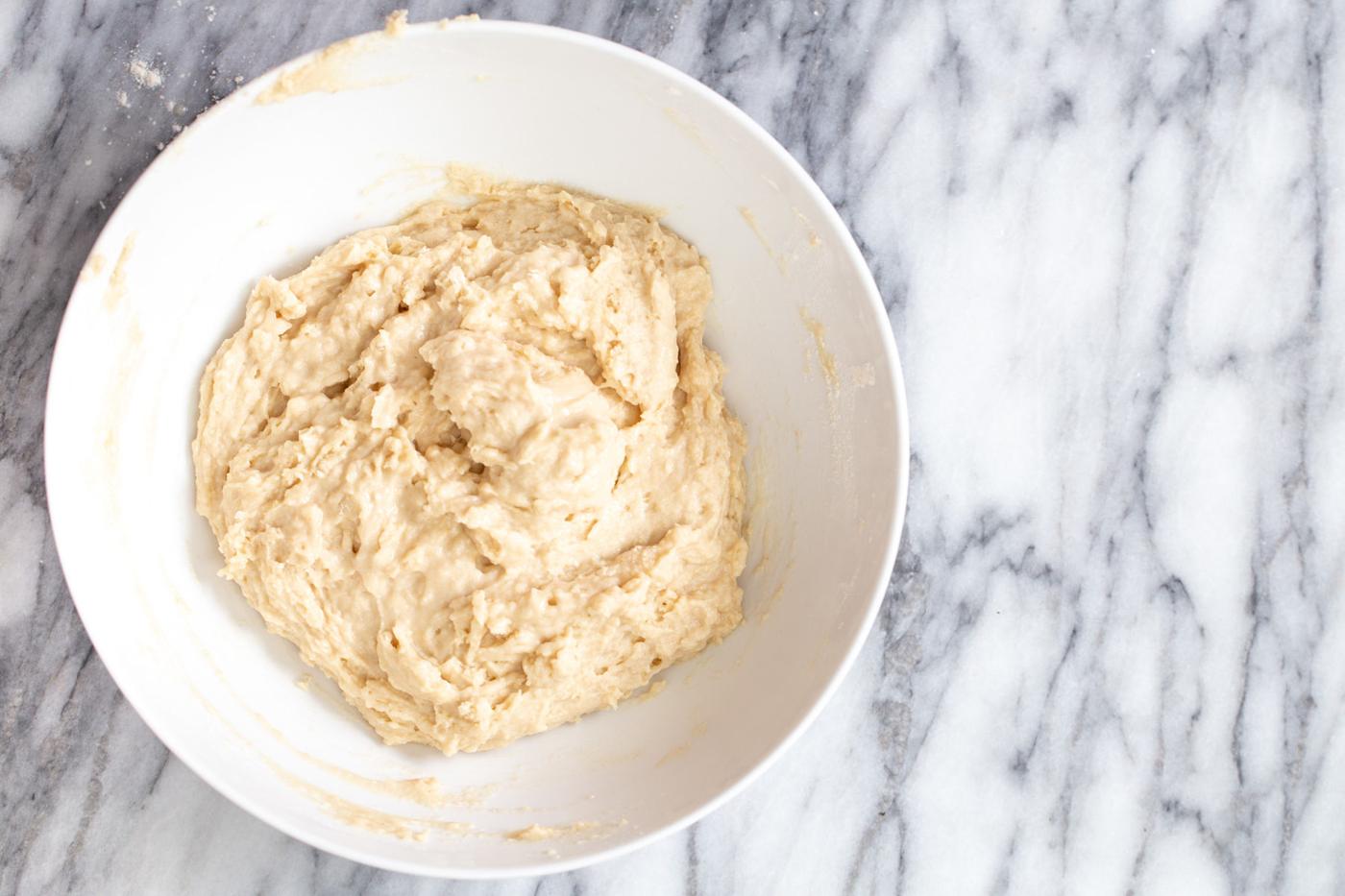 vegan lamington donut batter being mixed in a bowl