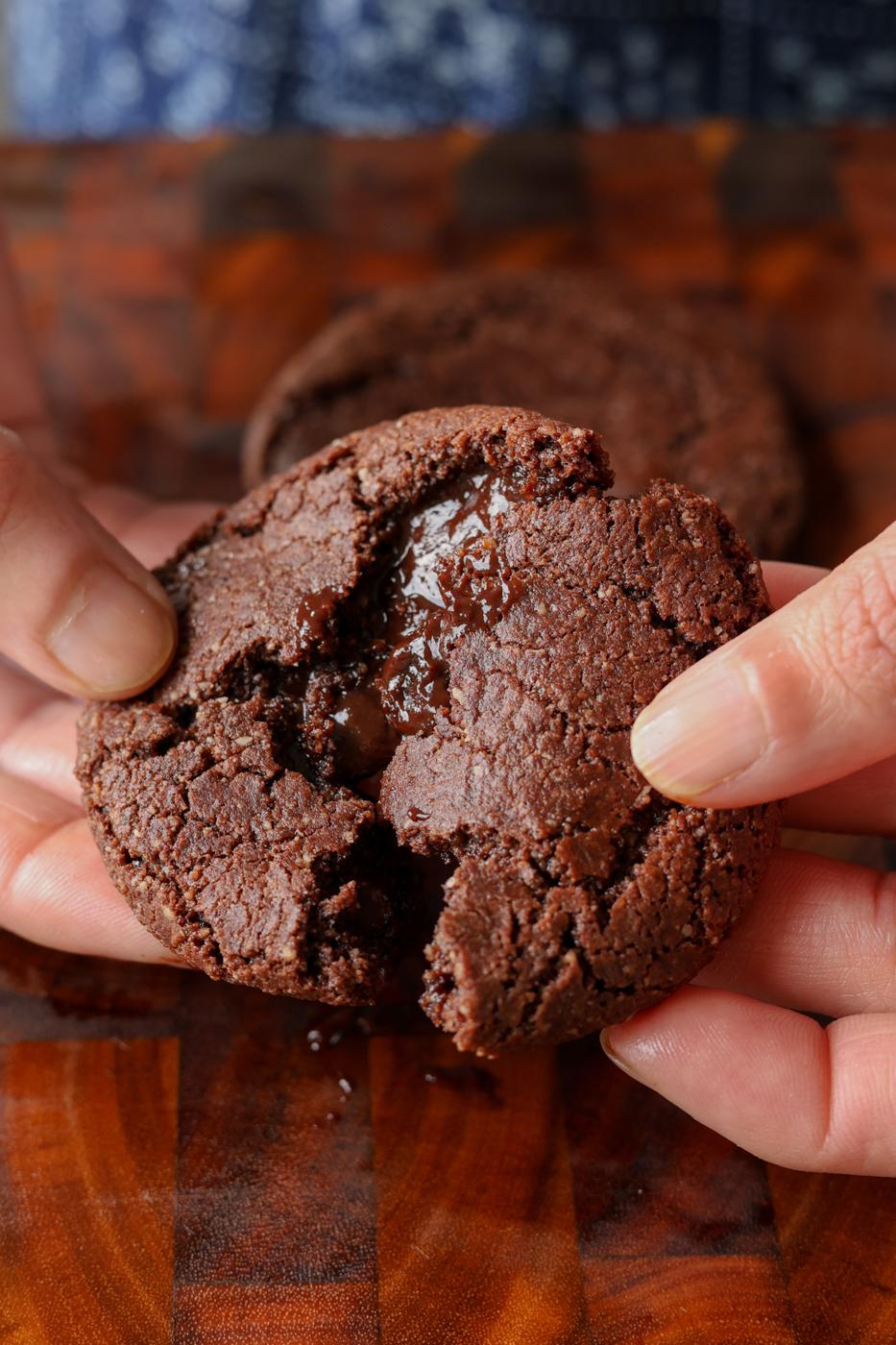 breaking open a lava cookie so you can see the inside