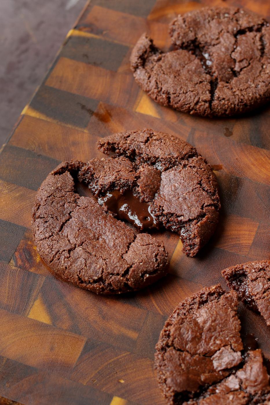 close-up of a broken open lava cookie on the cutting board