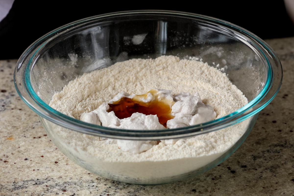 adding wet ingredients to the dry in the same bowl