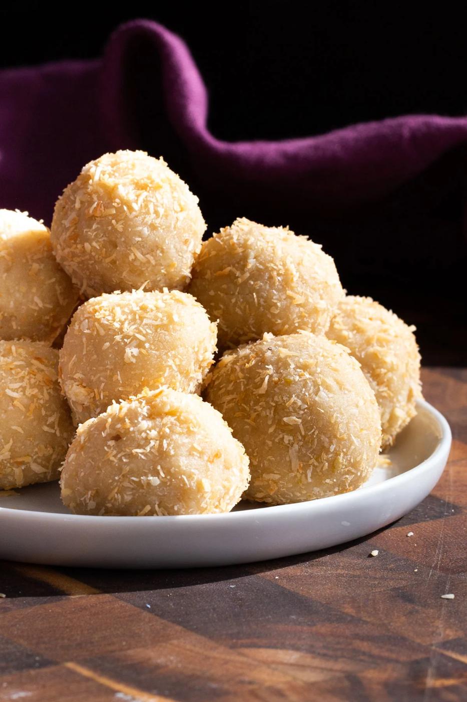 easy lemon coconut energy bites rolled in shredded coconut