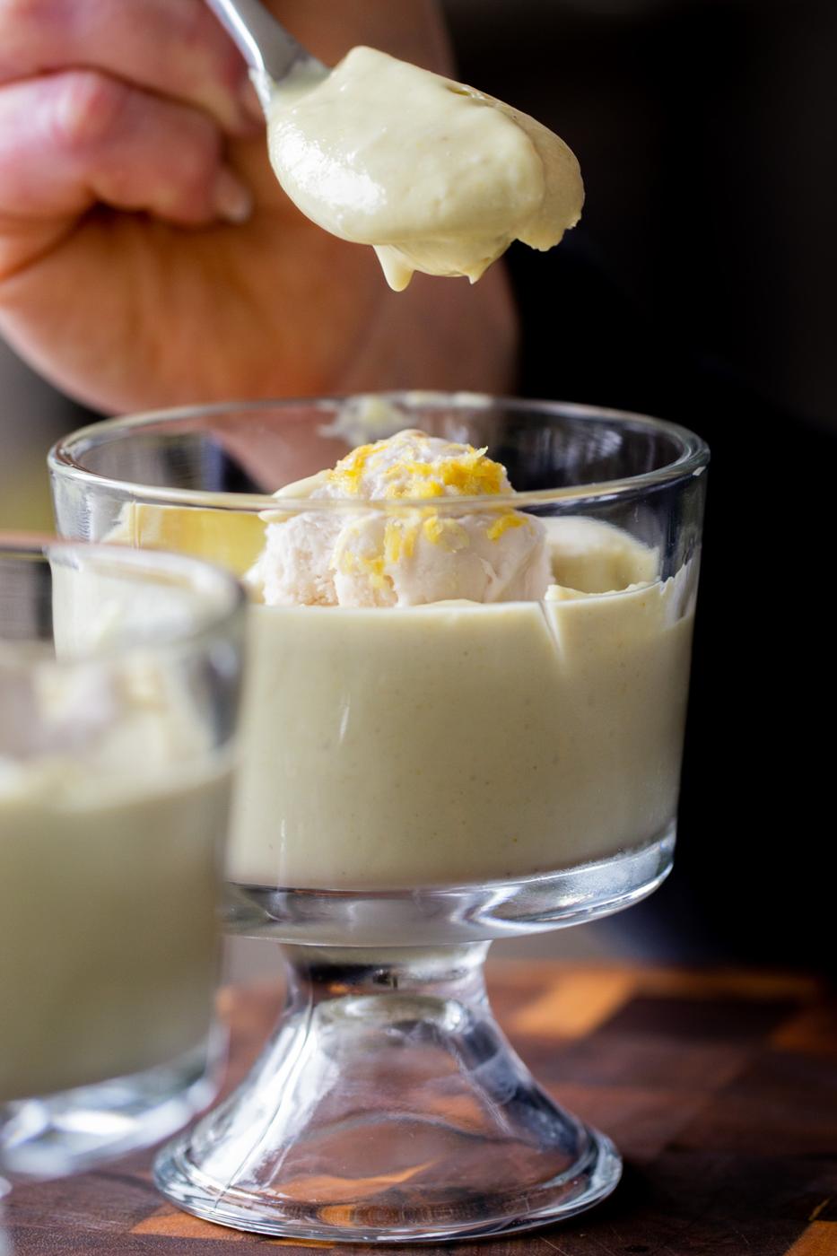 spoon taking a bite of lemon pudding