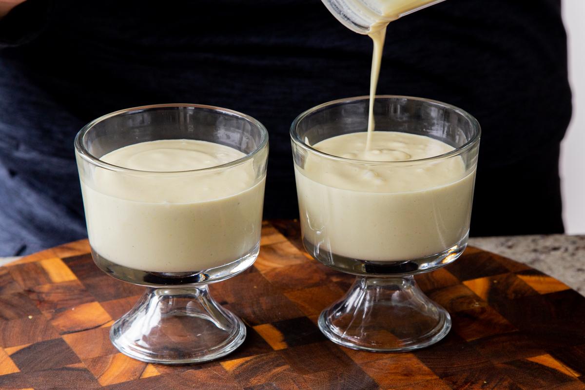 pouring blended lemon mixture into cups