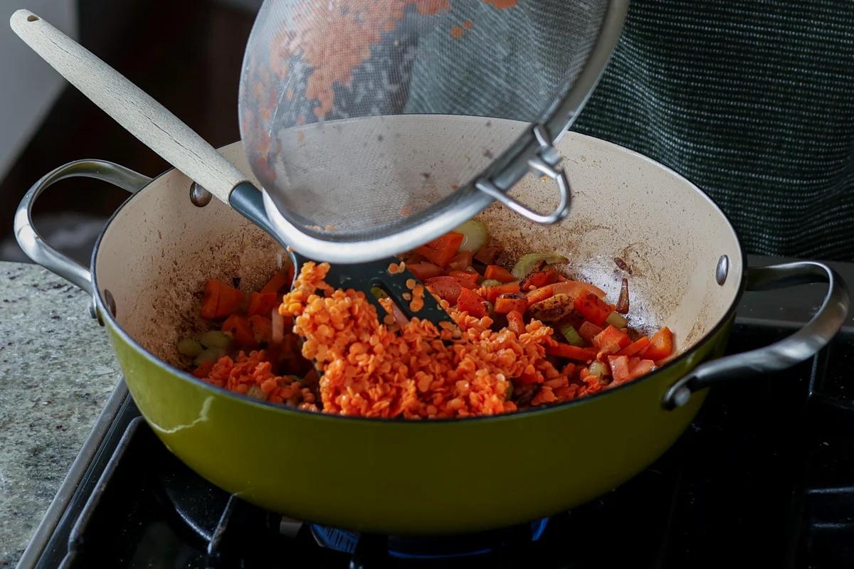 adding rinsed lentils to the pan