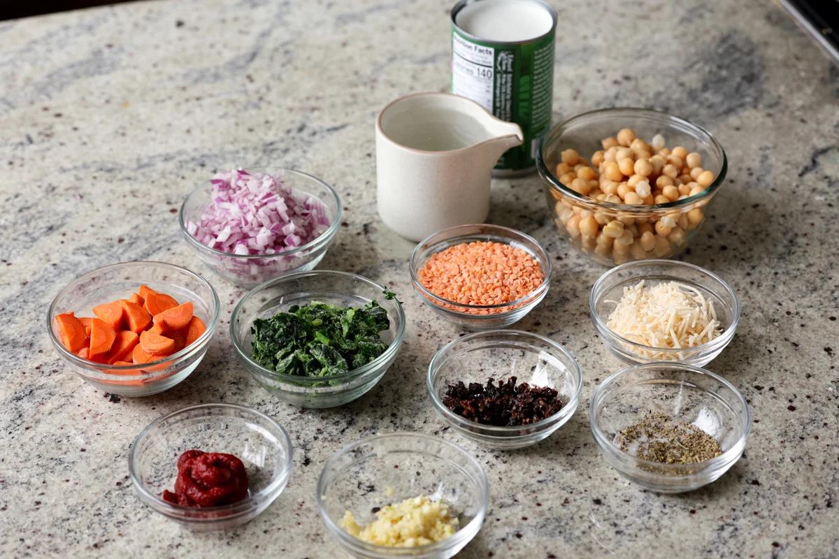 lentil chickpea stew ingredients in bowls on the kitchen counter