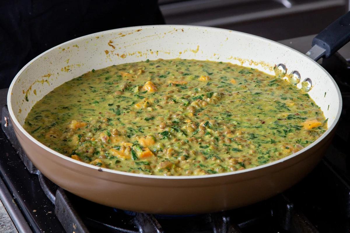 lentil coconut curry in the frying pan on the stove