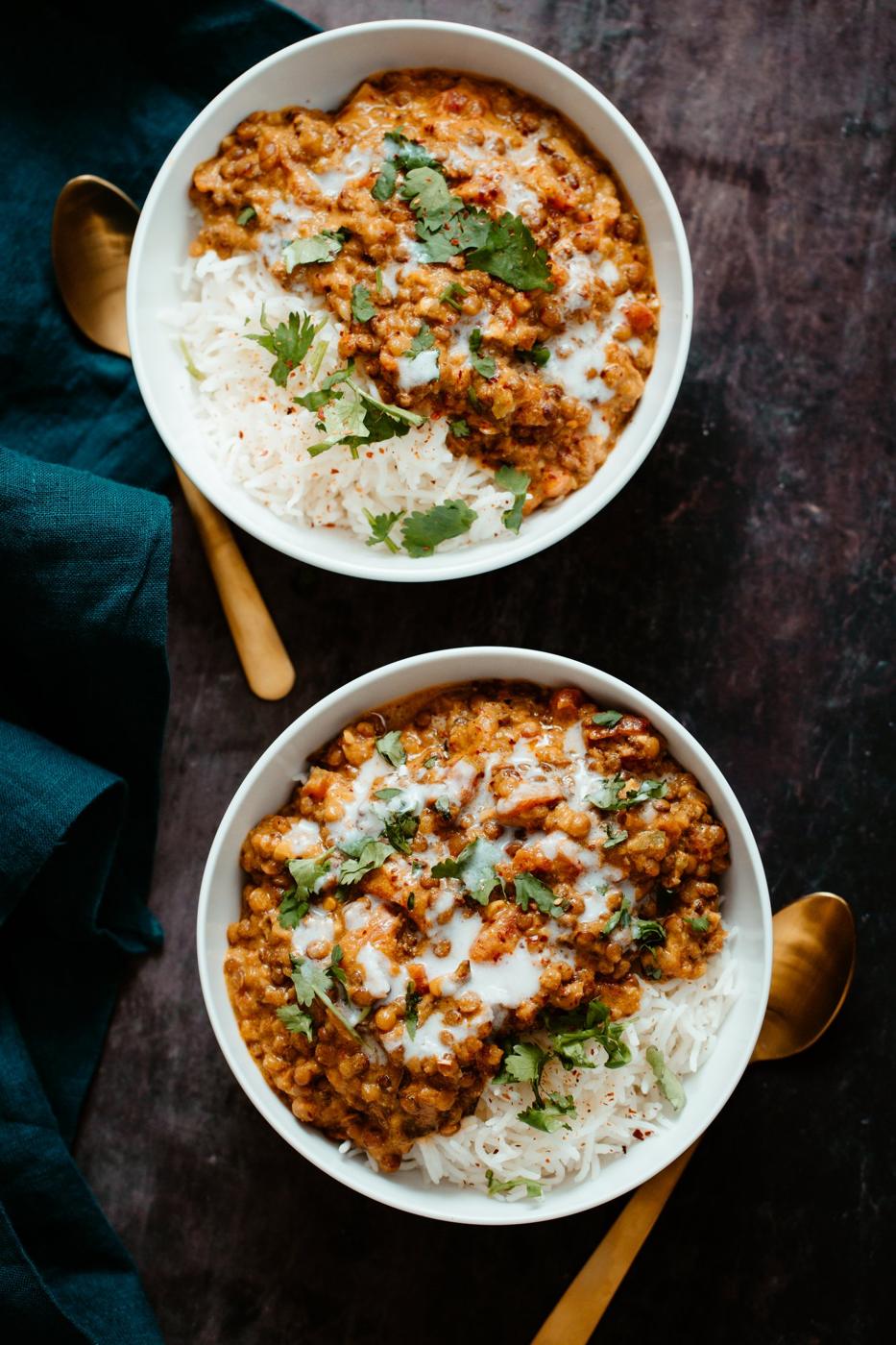 creamy Indian Lentil Casserole served in two bowl over rice