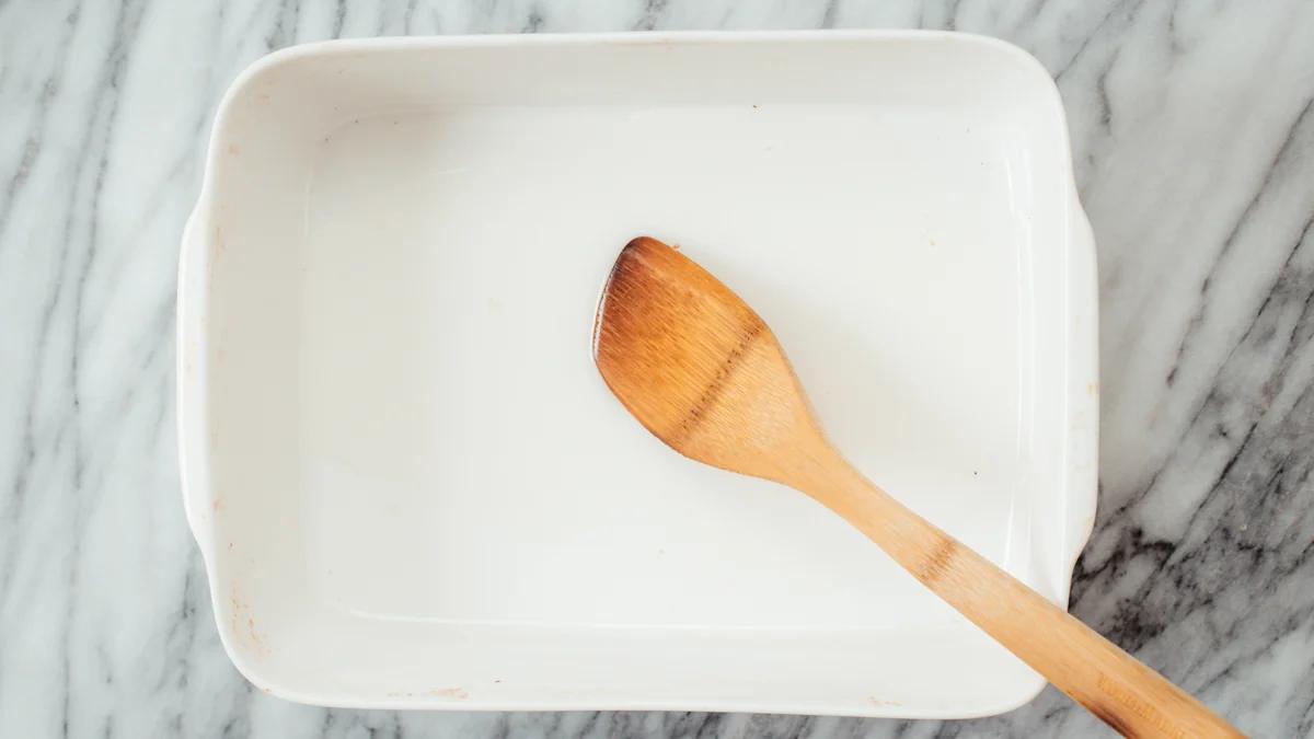 a white casserole dish with some oil