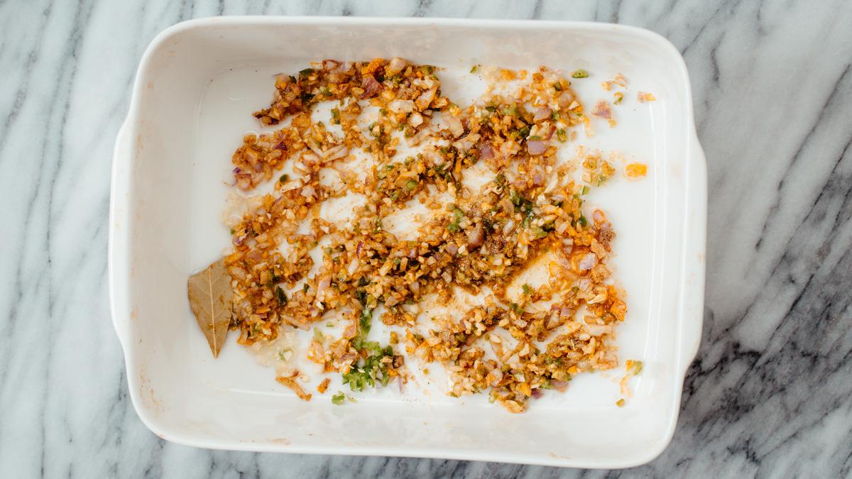 roasted onion, garlic and chilies in a casserole dish