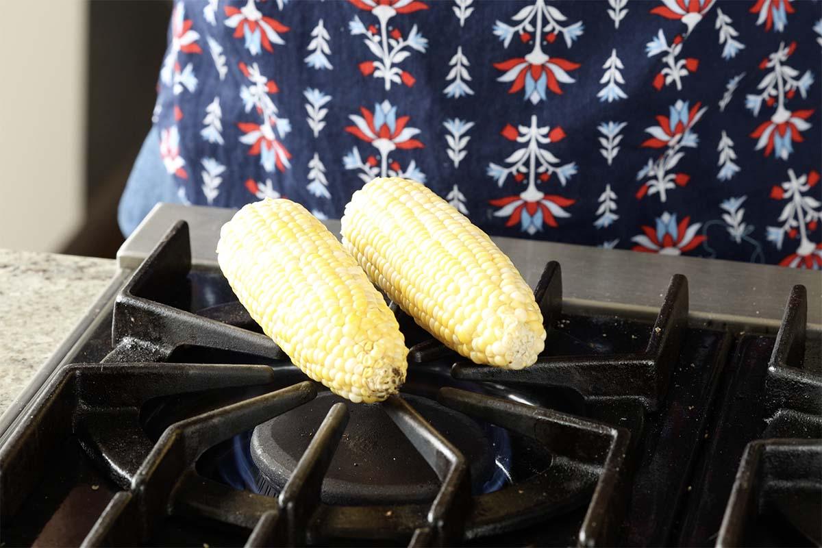 cooking corn on a gas stove