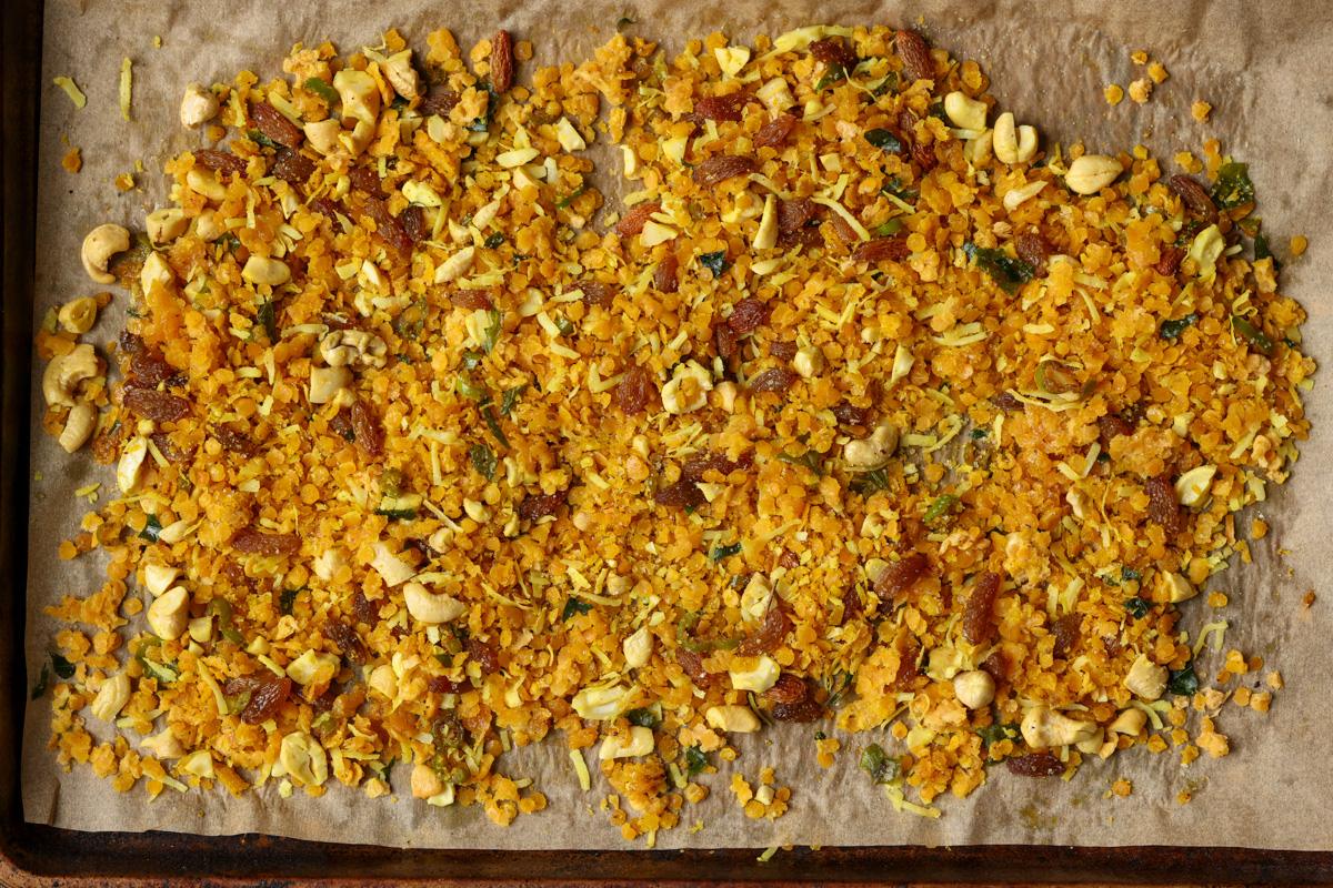 Indian-spiced savory lentil granola on the baking pan after baking