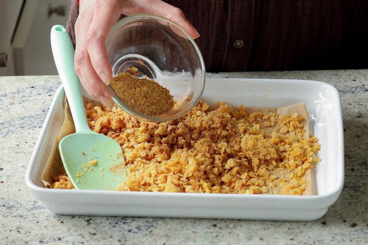 adding nacho cheese spice mix to the pan