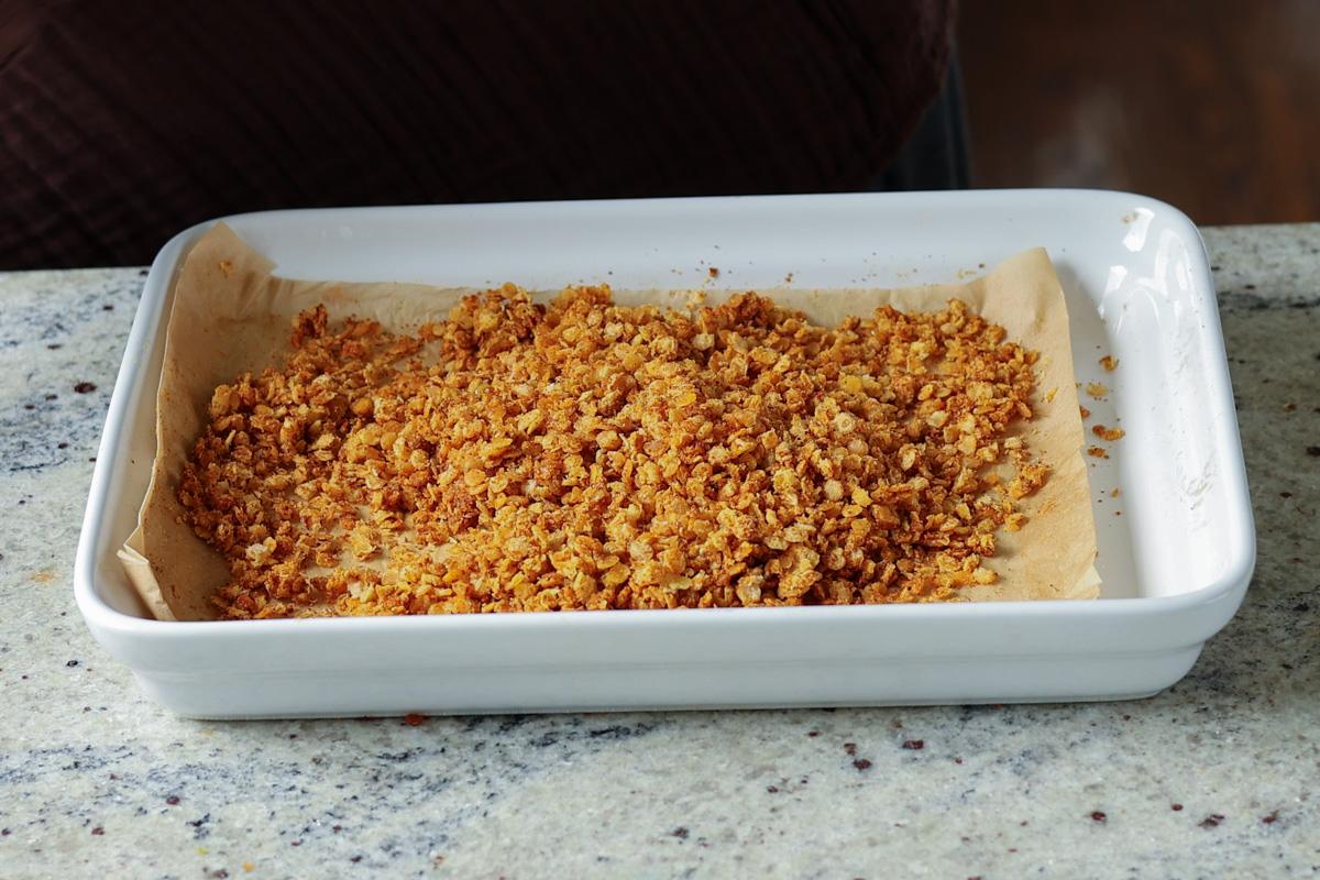nacho cheese granola on the baking sheet after baking