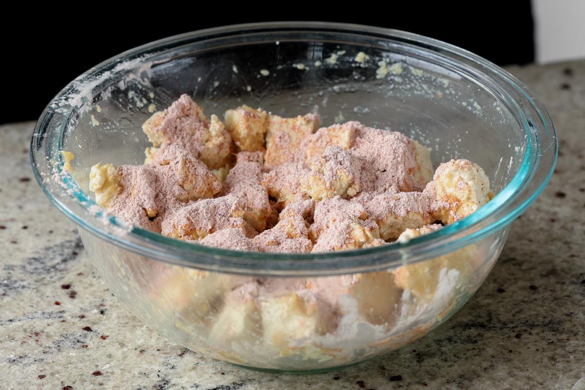 sprinkling on the spiced cornstarch mixture over the tofu