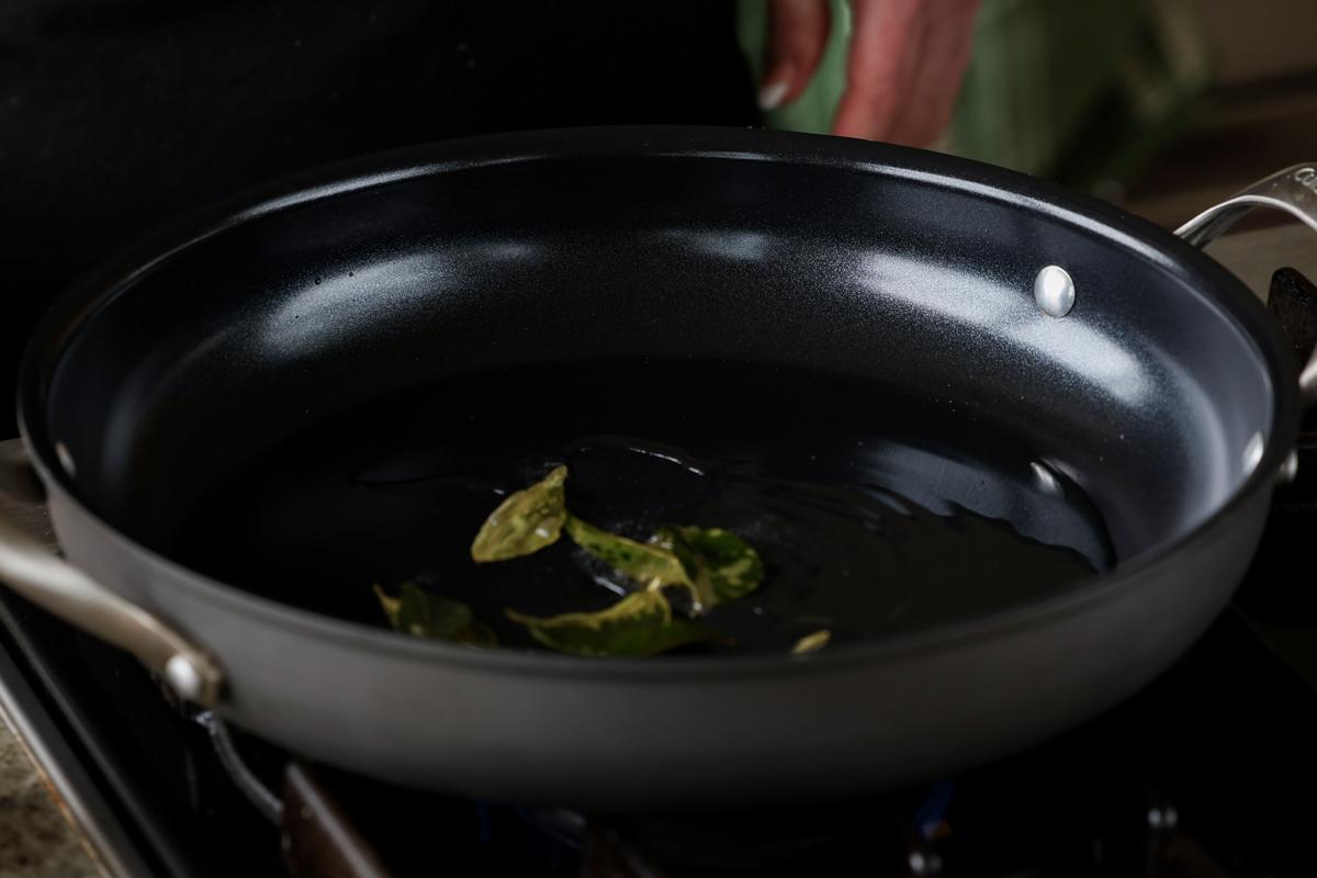 toasting the curry leaves