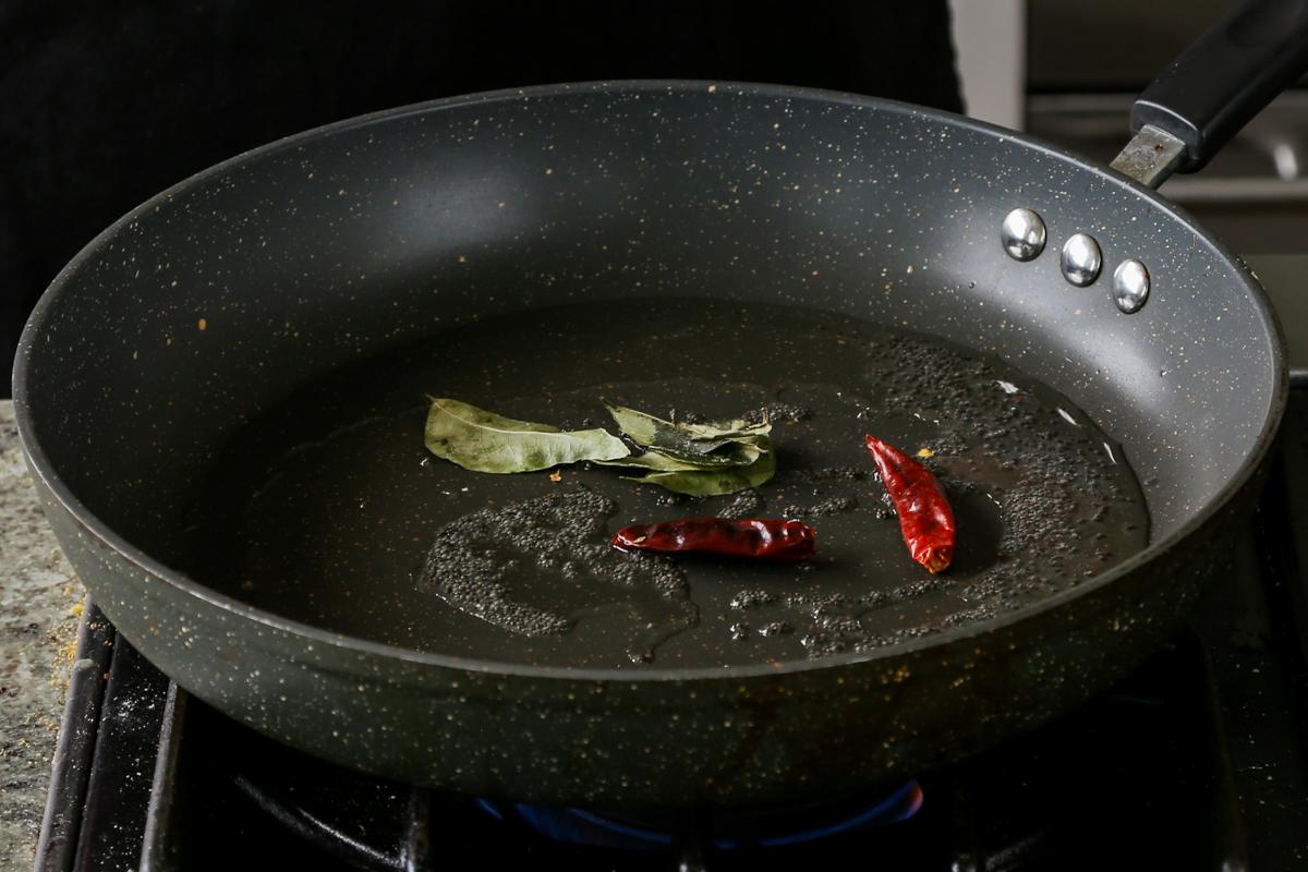 roasting the whole spices in a pan