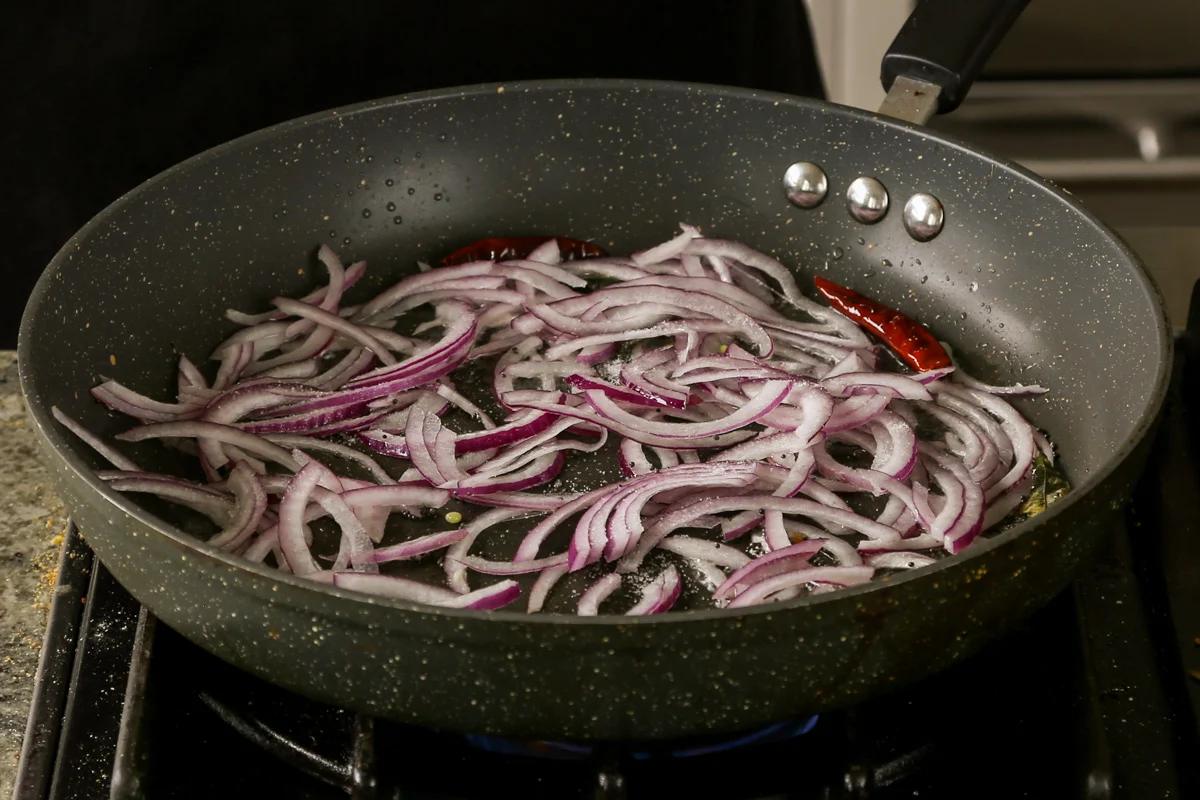 adding onion to the pan