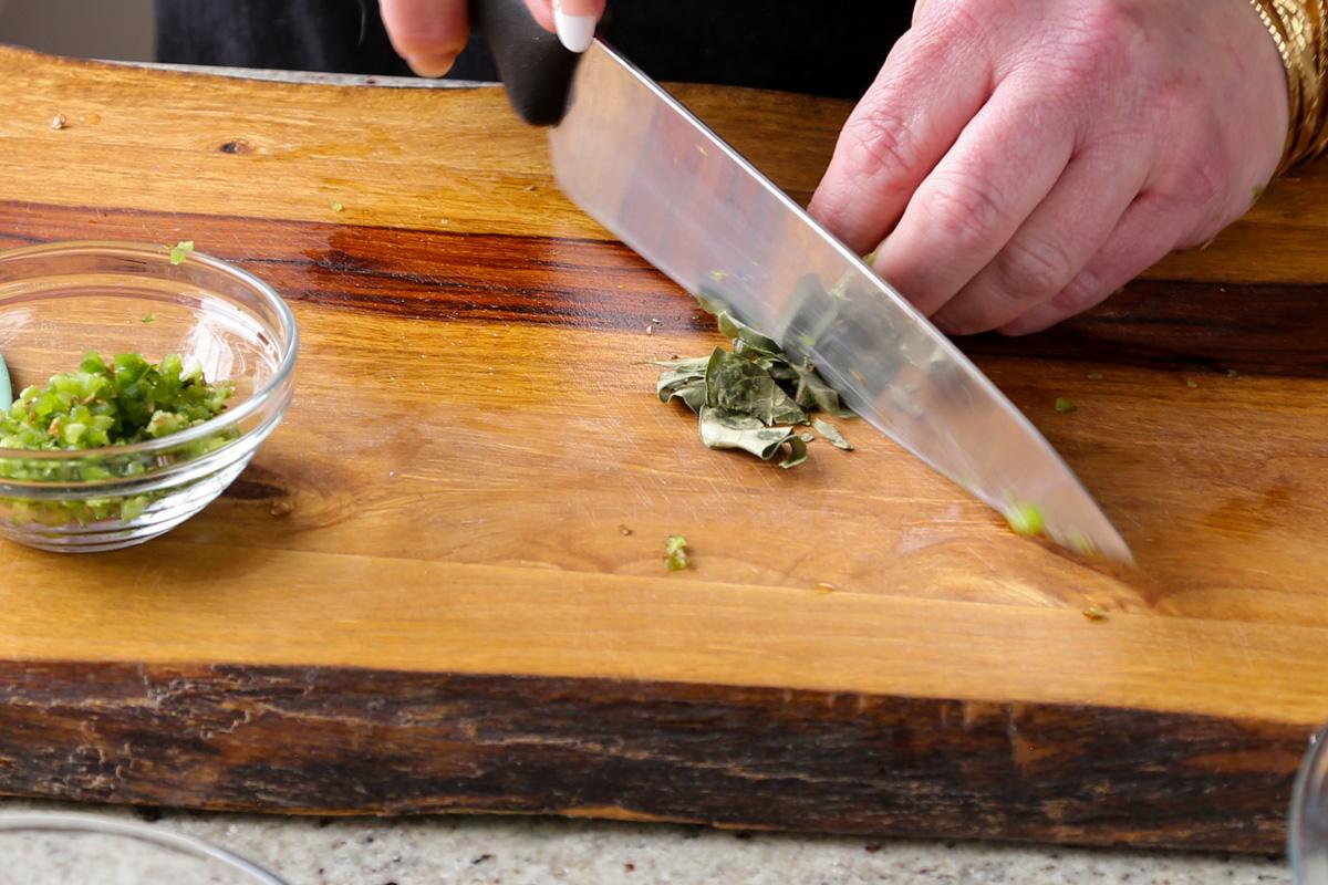 chopping the curry leaves