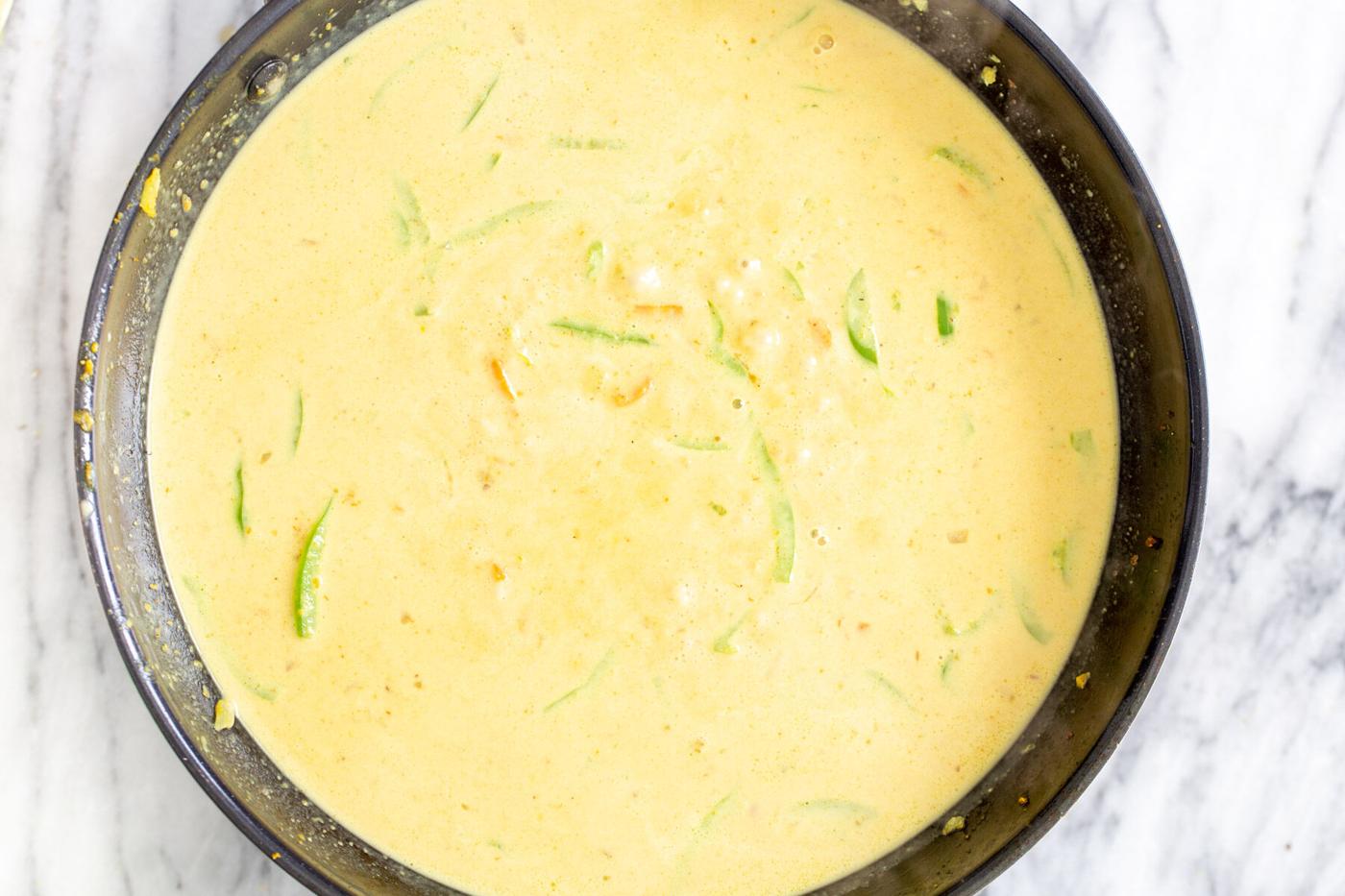 coconut curry in a sauteeing pan