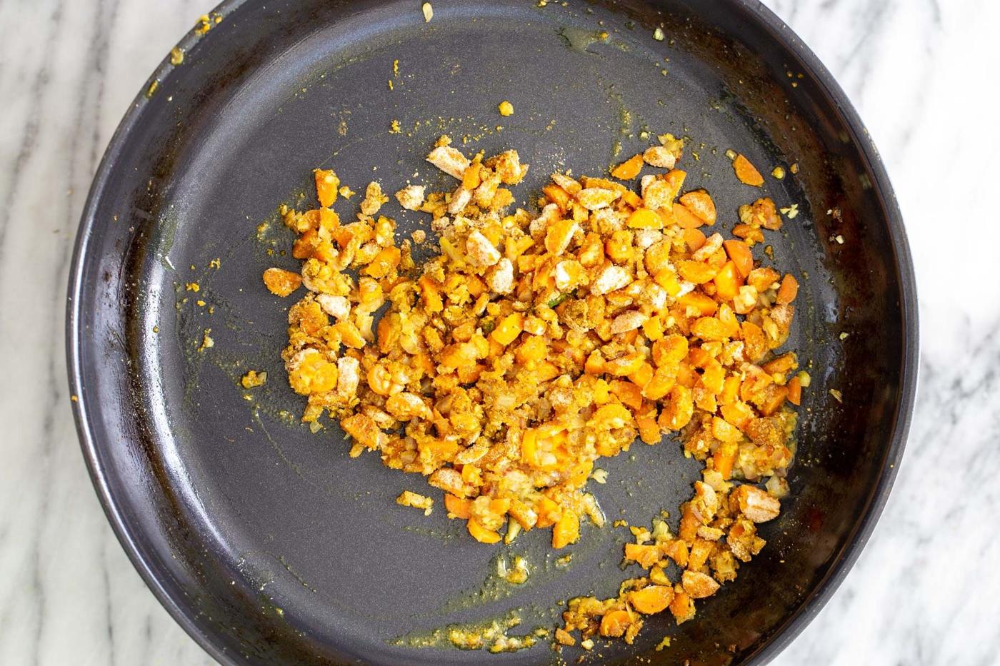 chopped sauteed veggies and garlic in a skillet