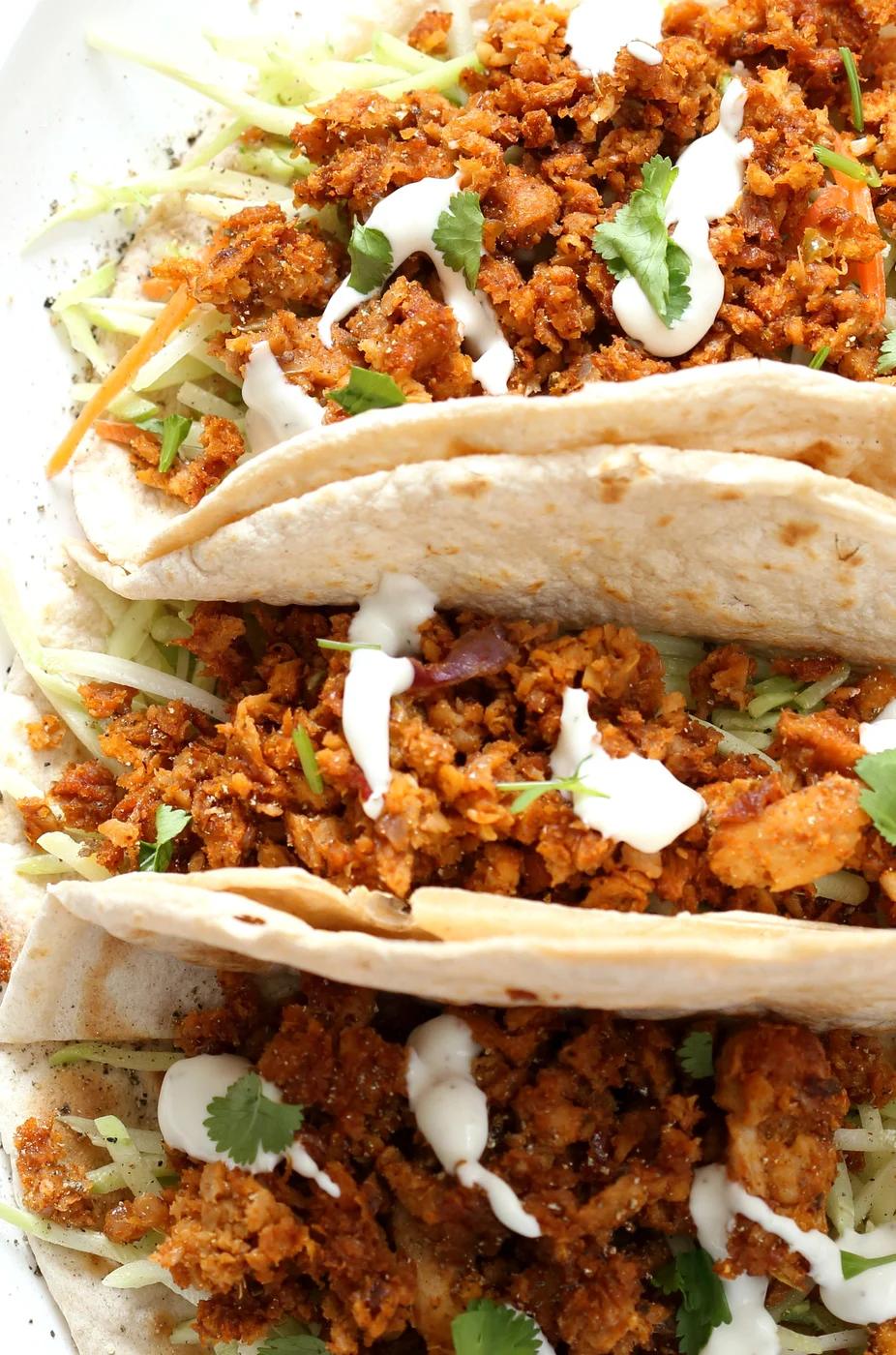 Mango BBQ Soy Curls or Jackfruit Tacos. Shredded Soy Curls or Jackfruit make a an amazing carrier for bbq sauce. Some Mango or other fruit puree takes it to the next level. Serve in sandwiches or tacos with slaw. #Vegan #Glutenfree #Recipe #veganricha | VeganRicha.com