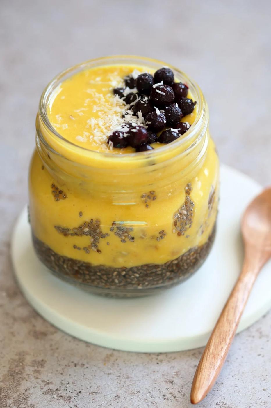 Vegan Turmeric Mango Overnight Oats with Chia seeds in a glass jar