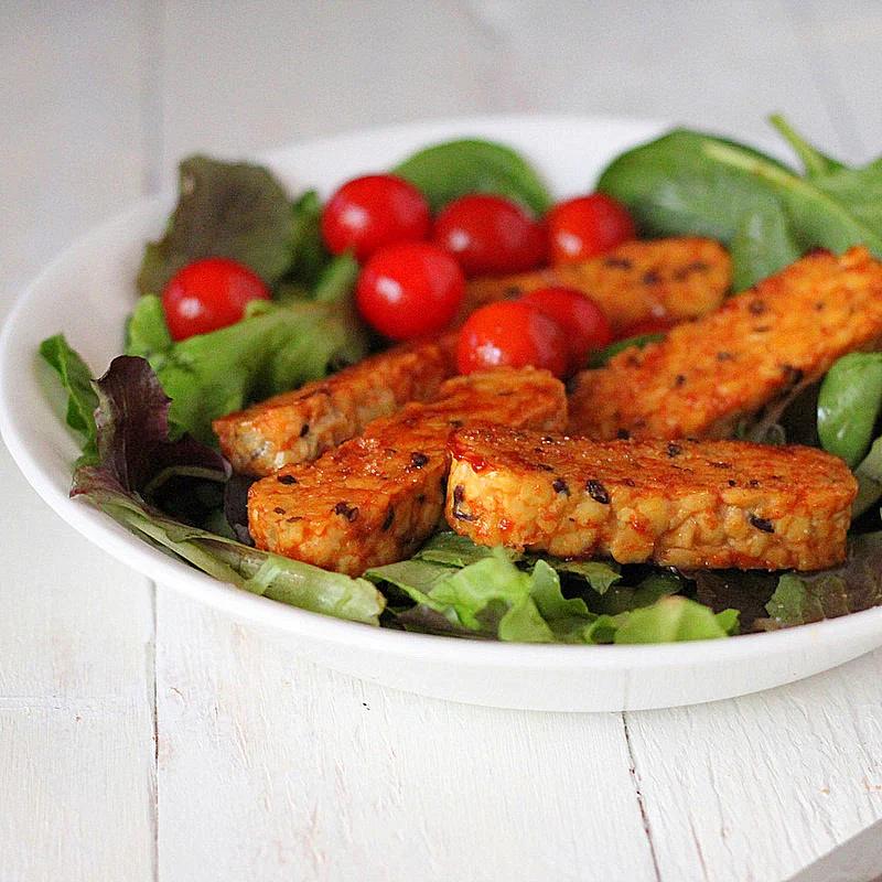 Maple glazed Tempeh, cherry tomatoes and baby greens Salad. vegan, glutenfree