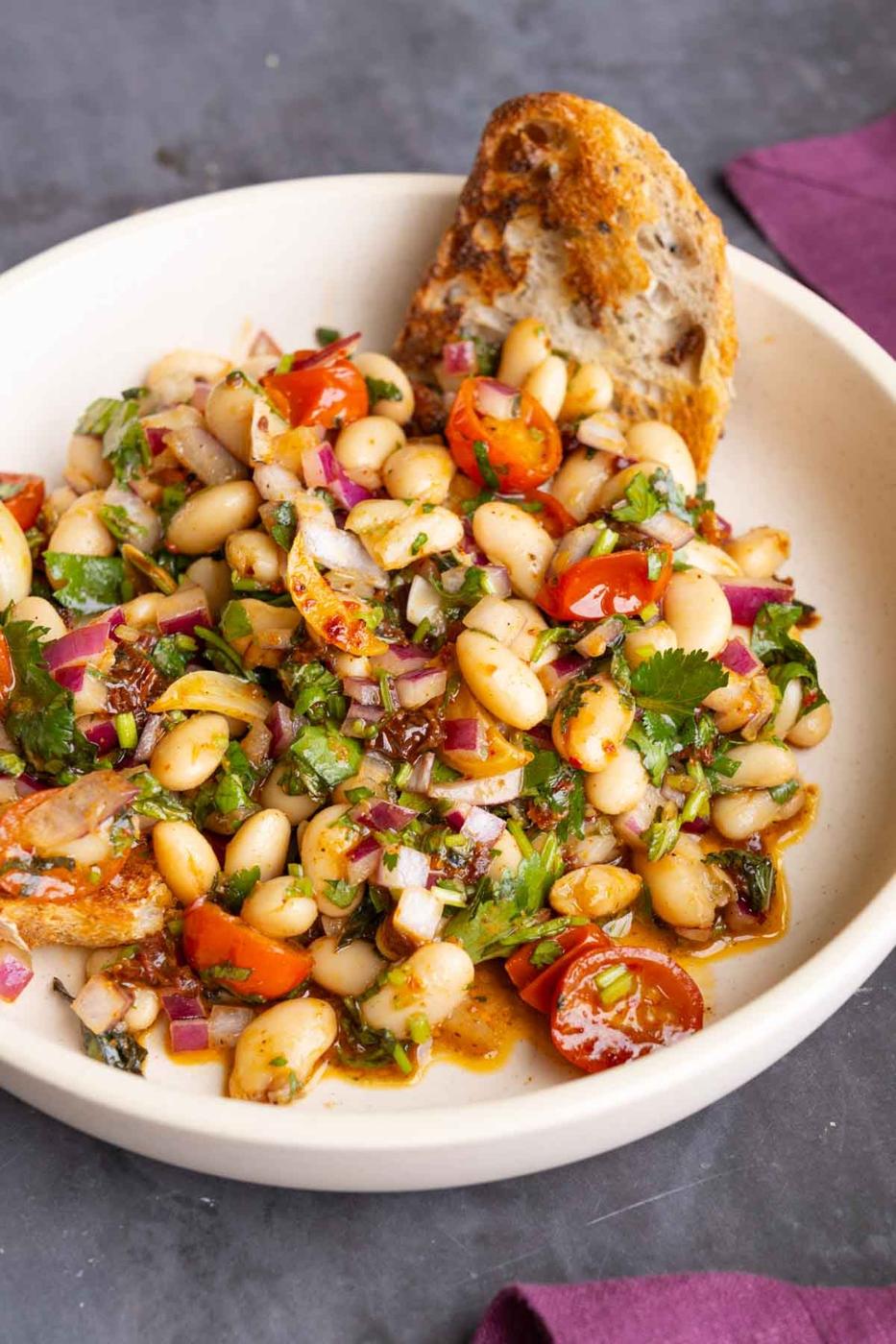 marinated white bean salad with bread to dip