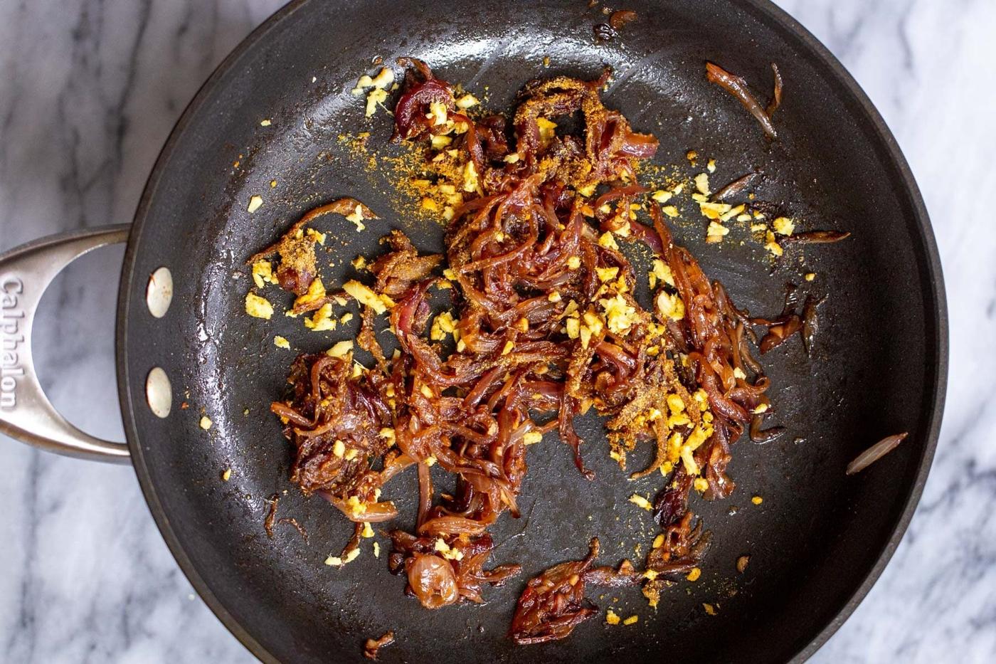 sauteed tempered onions and ginger in sauteeing pan