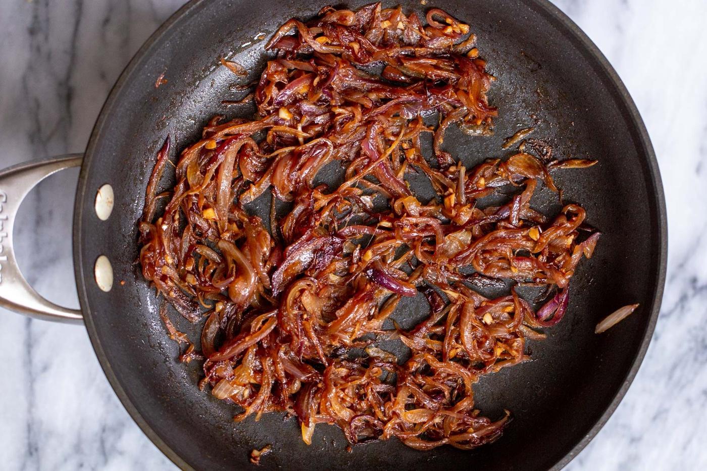 onions and tempered spices in a sauteeing pan