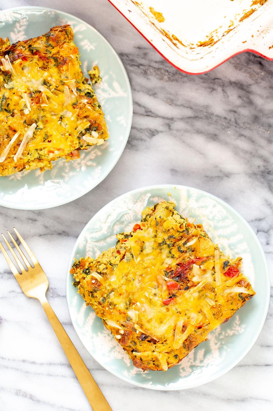 two servings of vegan Mexican breakfast casserole with tofu eggs, cheese and vegetables