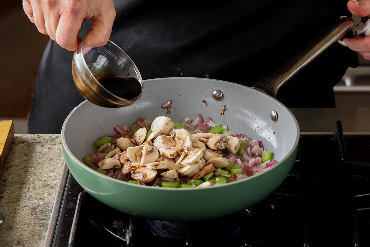 adding mushrooms and balsamic to the pan