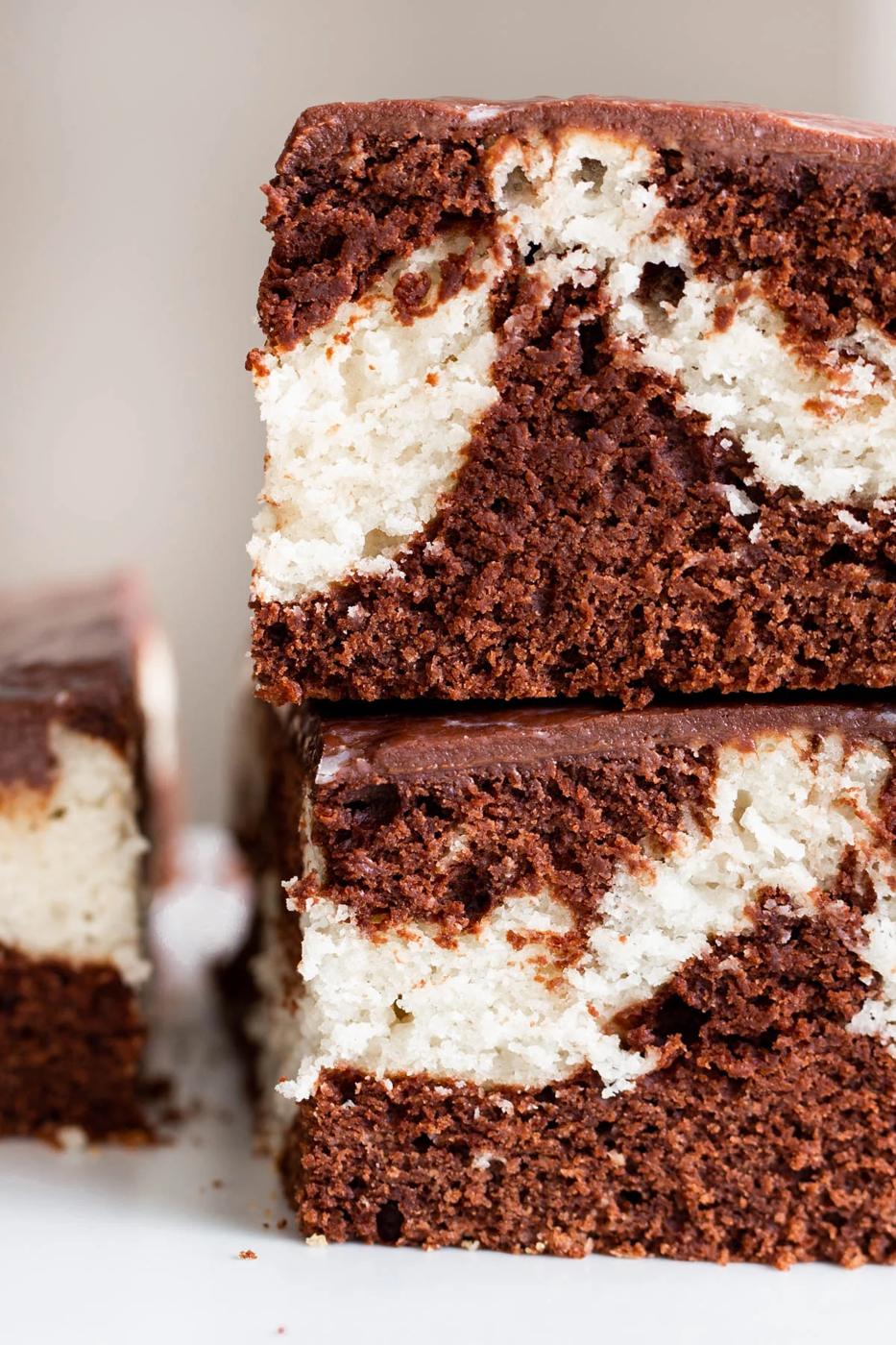 two pieces of stacked vegan mocha marble cake with ganache