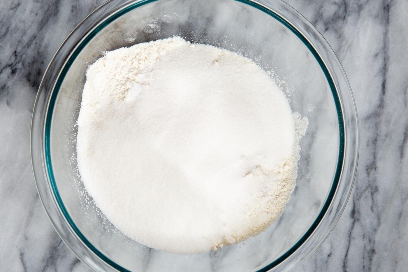 dry cake ingredients in a class bowl