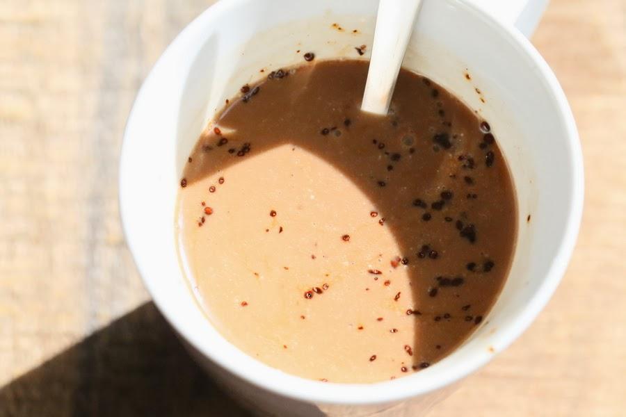 melted dark chocolate being stirred into almond milk
