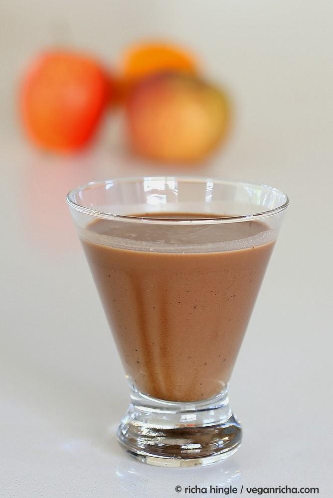 side view of a glass of vegan chocolate milkshake made with almond milk
