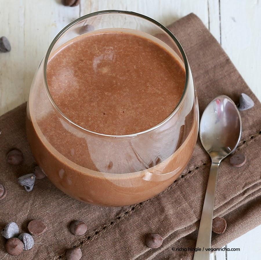 overhead shot of a glass with healthy creamy and thick vegan chocolate milkshake