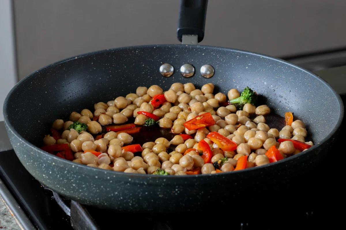 adding sauce to the pan