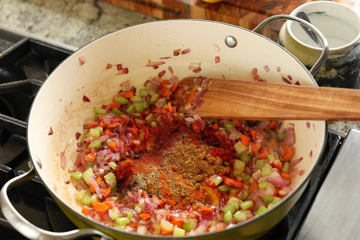 adding spices to the pan